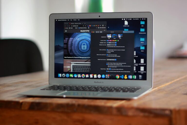 Open MacBook Air with apps and web browser on screen, placed on a wooden table indoors.